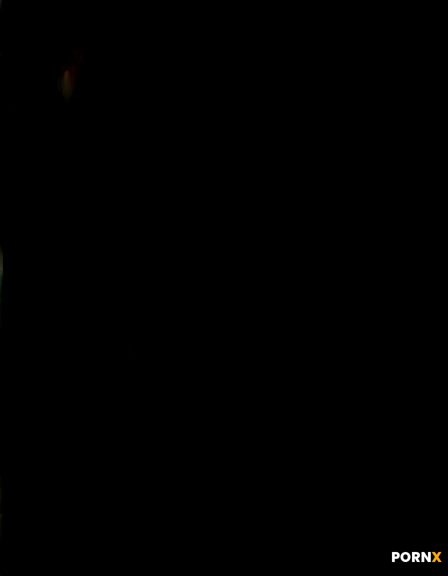 A lithe woman with midnight-black hair cascading over her shoulders, full breasts and a curvy hips, gazes seductively at the camera with a half-smile, her eyes glimmering under soft rim lighting. She arches her back on a sleek, marble countertop, her naked torso glistening with a sheen of warm oil, while a muscular male partner leans in to press his hard erection against her shaved thighs. The scene is bathed in low amber light from vintage floor lamps, casting deep shadows that accentuate the curves of their bodies, with a shallow depth of field that blurs the modern loft's chrome décor behind them. The shot is taken from a low angle, slightly tilted, capturing the intimacy of their intertwined limbs and the raw, explicit contact. Rendered in hyper-realistic digital painting style, with crisp detail on skin texture and a cinematic, glossy finish.