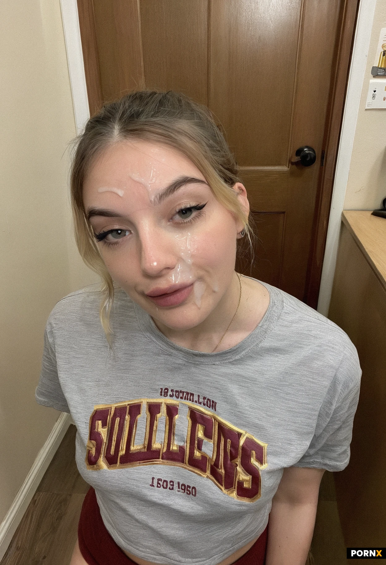 18 year old woman college dorm hallway baggy shirt underpants cum on her lips eye contact 2010s