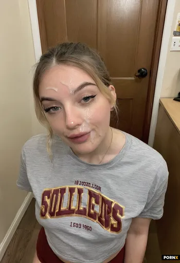 18 year old woman college dorm hallway baggy shirt underpants cum on her lips eye contact 2010s