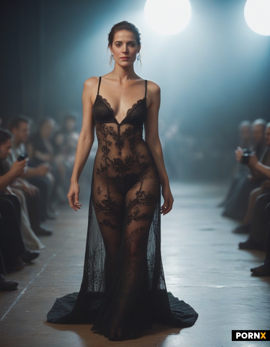 sensual and elegant woman standing perfectly centered under a single spotlight shining vertically fr
