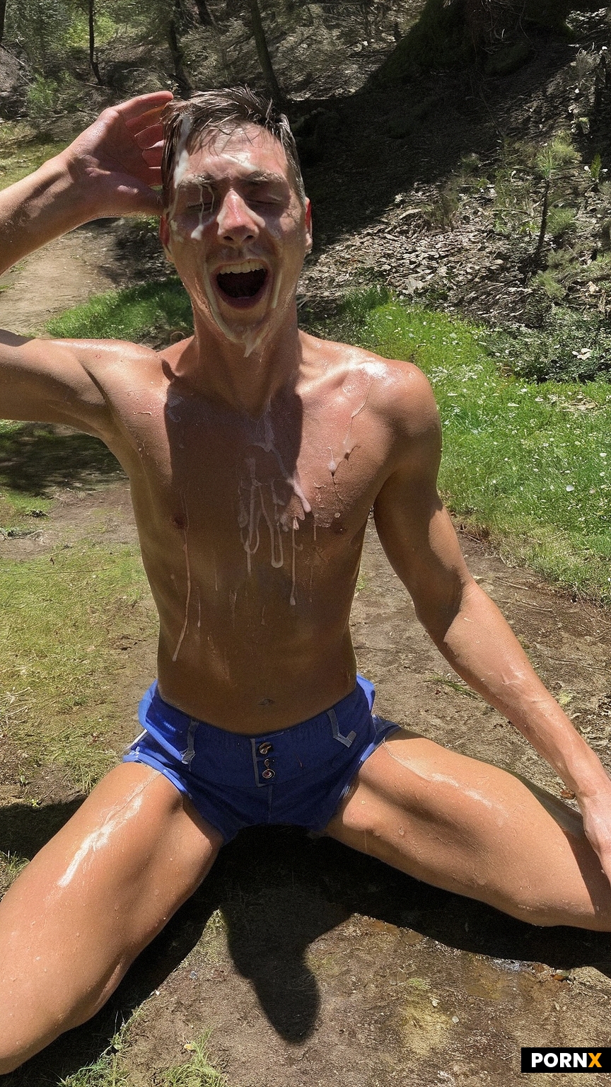 A clean-shaven French man in his mid-30s with a skinny build wears tight denim shorts and kneels on 