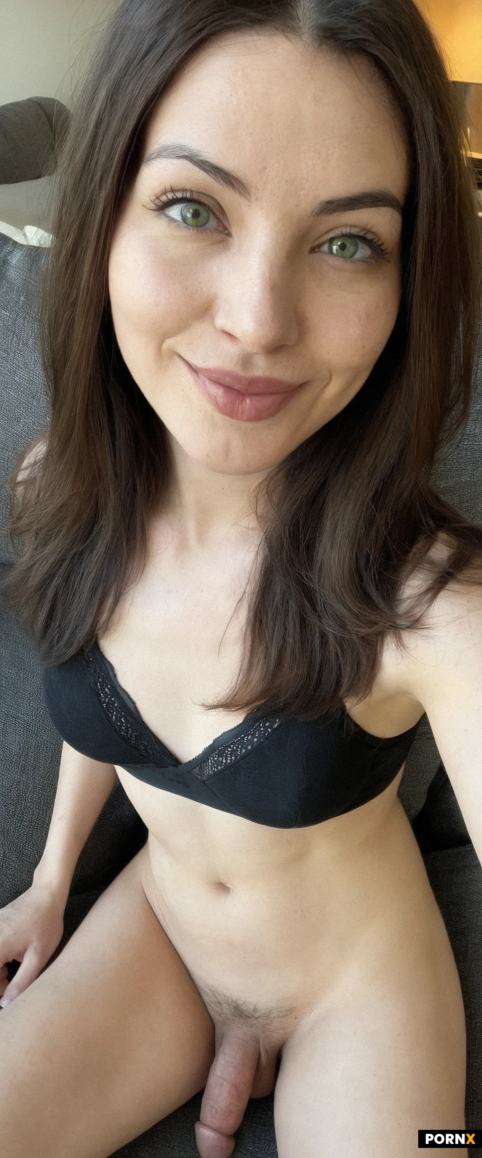 side view,view from above,One beautiful American woman sitting on couch,looking at viewer,30 years old,smiling,black bra,round face,no makeup,brunette hair,green eyes,small breasts,living room,straight hair,(detailed penis),loose testicles,solo