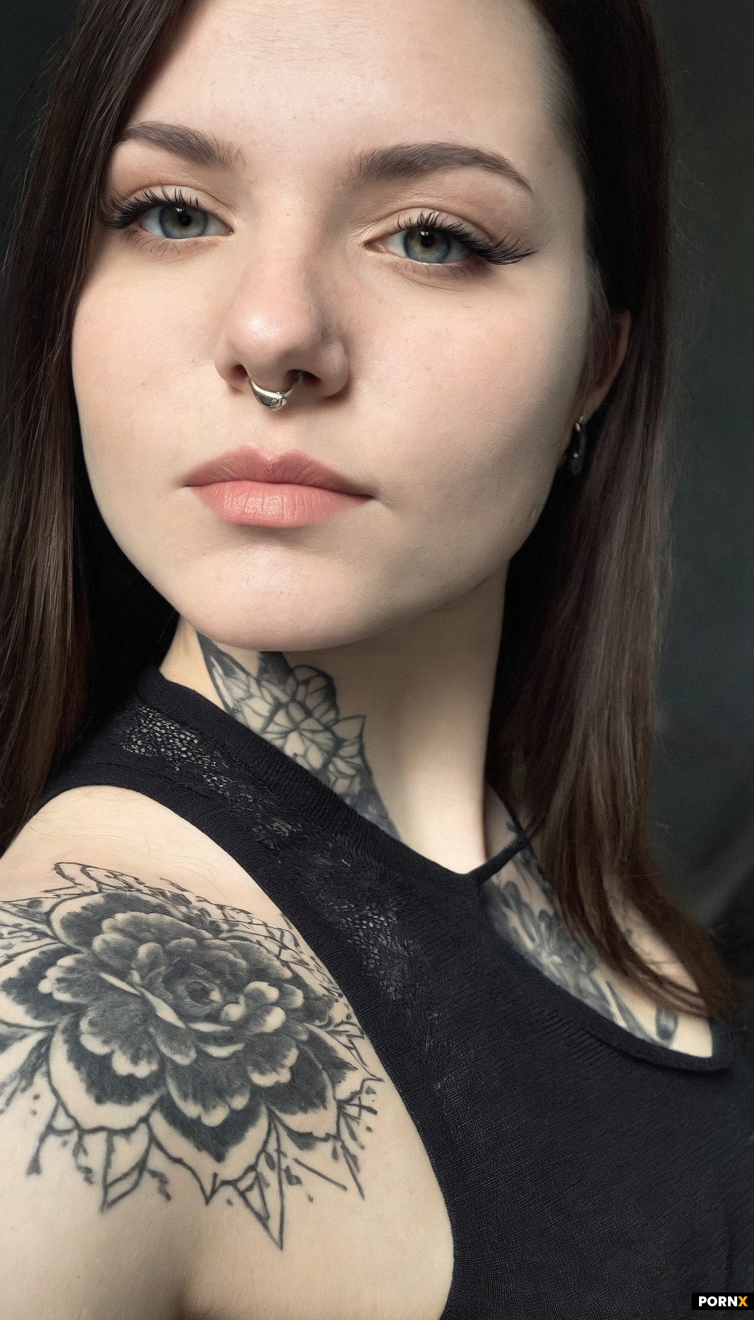 A tightly framed head-and-shoulders portrait of an adult woman around 25 to 29 years old with fair s