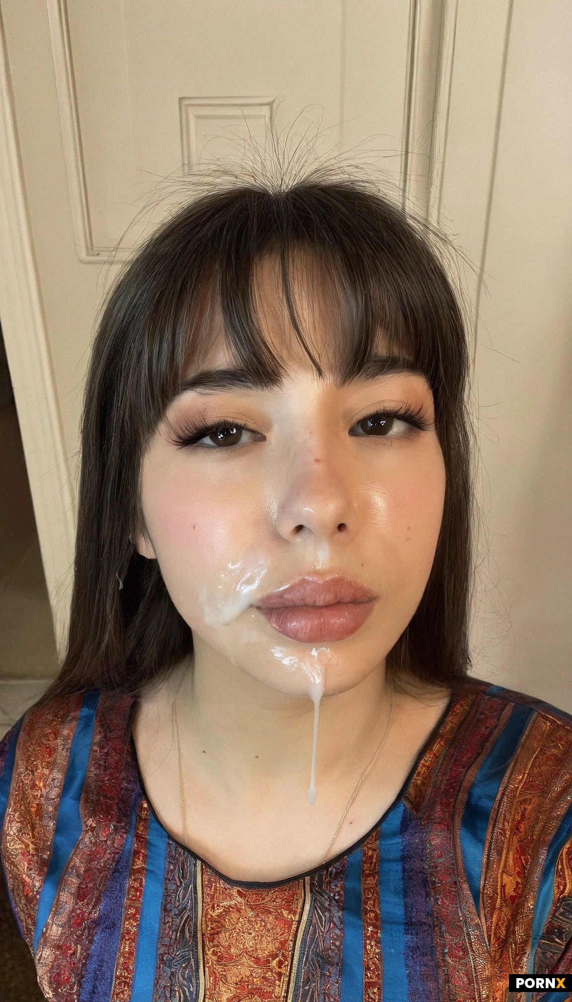 20 years old. wearing a silk top. cum on face, 8k resolution